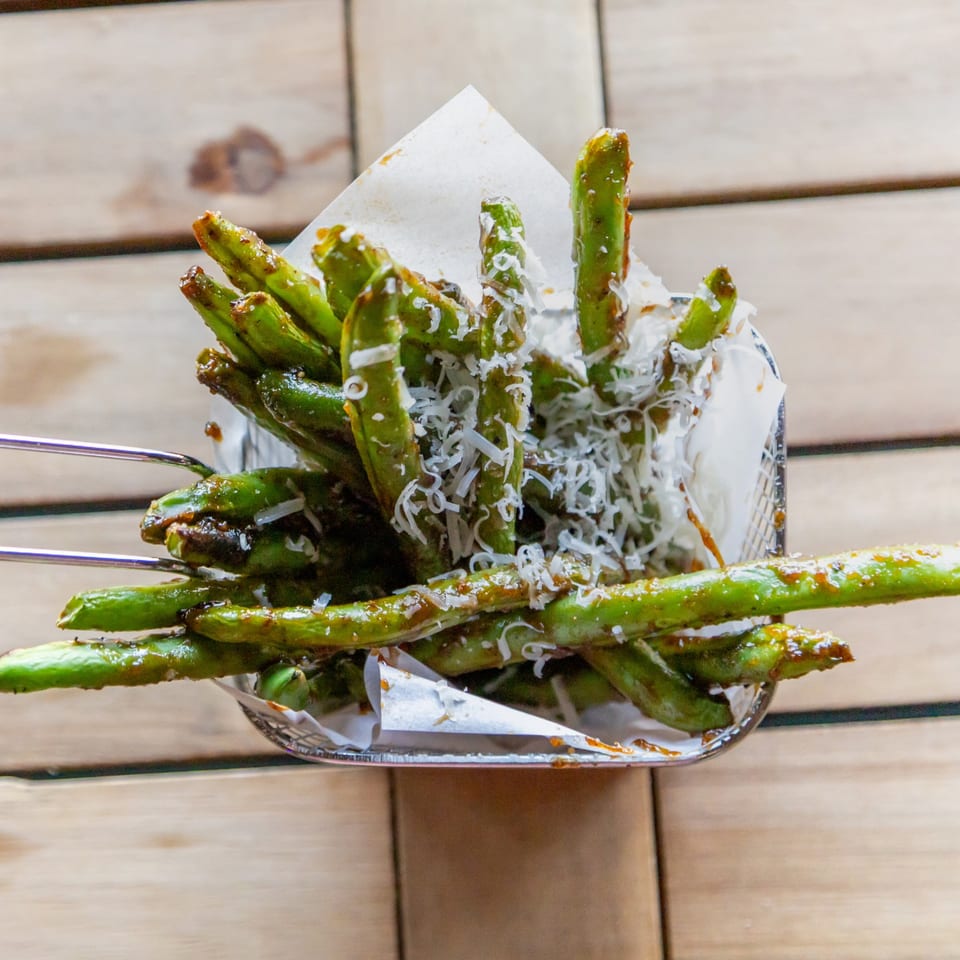 Green beans with grated cheese