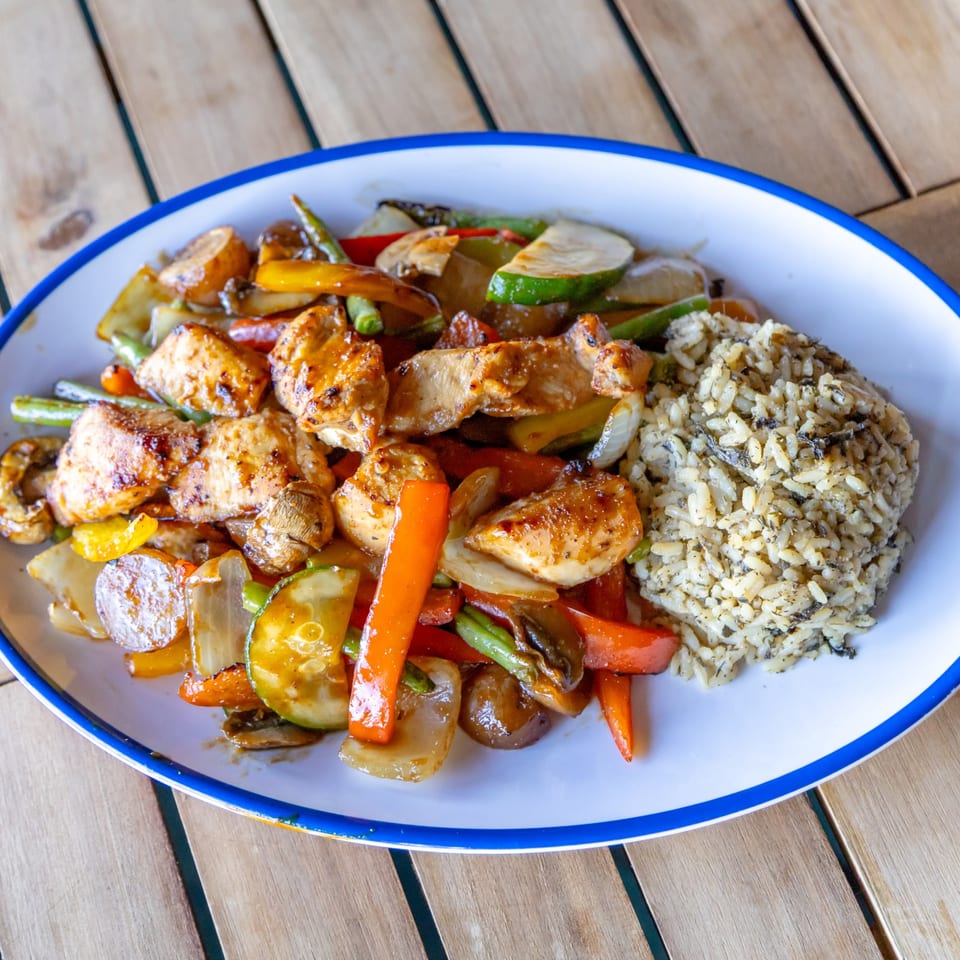 Chicken house plate with rice and vegetables
