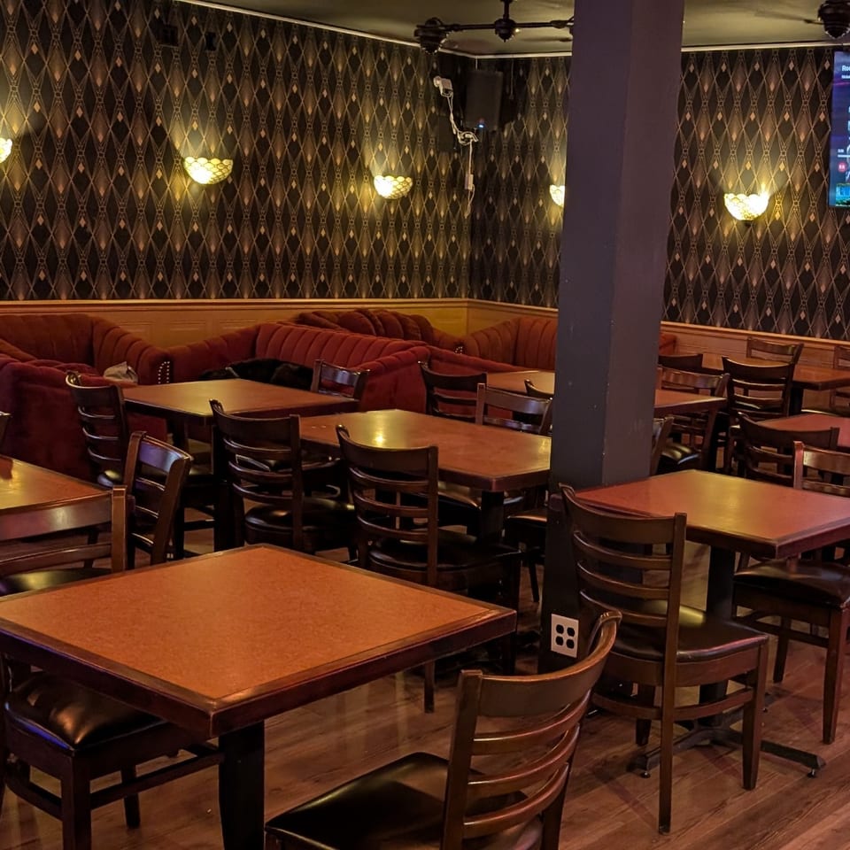 Stein Haus dining tables and red velvet lounge seating