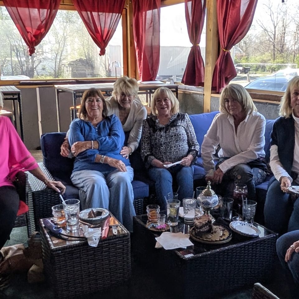 Guests gathered in the window-lined seating area